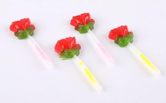 La fluorescence allument la lucette de forme de fleur de Rose de sucrerie avec le bâton d'éclairage